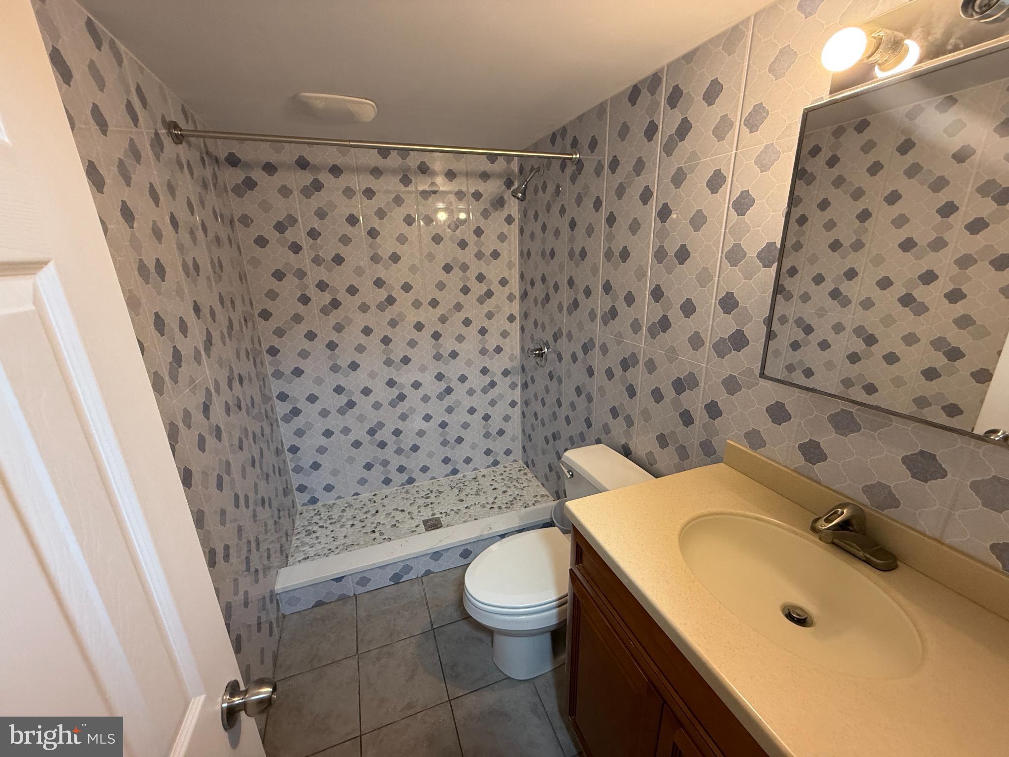 7735 Loretto Avenue Philadelphia, PA 19111 - Photo 14 of 19 a bathroom with a sink and a toilet