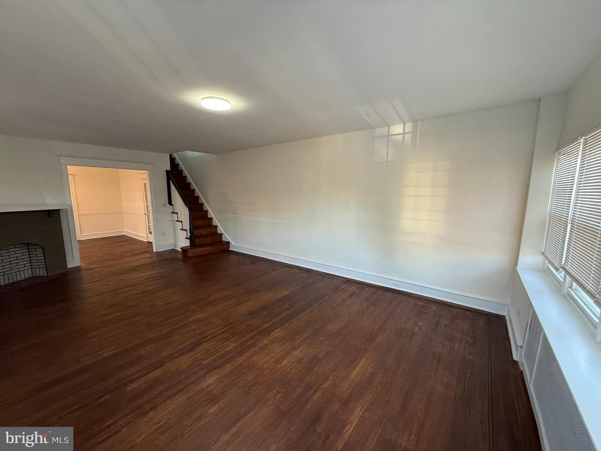 7735 Loretto Avenue Philadelphia, PA 19111 - Photo 4 of 19 an empty room with wooden floor and windows