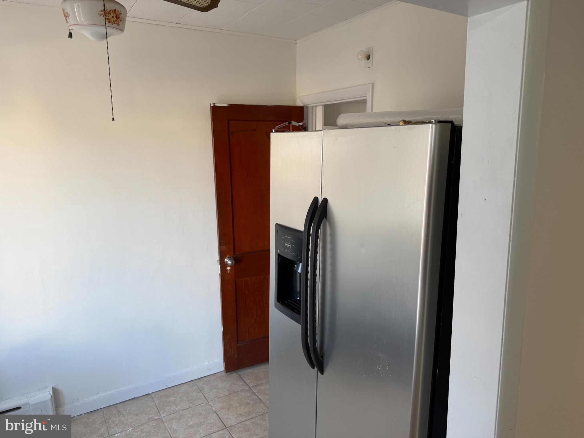 7735 Loretto Avenue Philadelphia, PA 19111 - Photo 10 of 19 a refrigerator freezer sitting inside of a kitchen