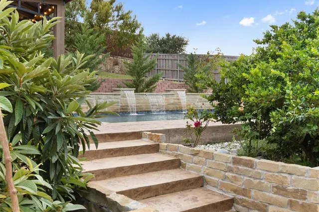 a view of a swimming pool with a patio