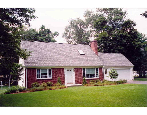124 Whitmun Road Longmeadow, MA 01106 - Photo 1 of 1 a view of a brick house with a yard