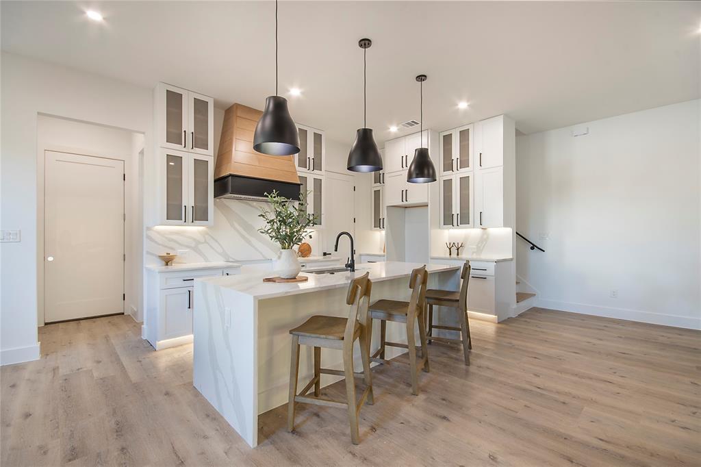 2003 Hearne Avenue Dallas, TX 75208 - Photo 5 of 39 a living room with stainless steel appliances kitchen island granite countertop furniture and a wooden floor