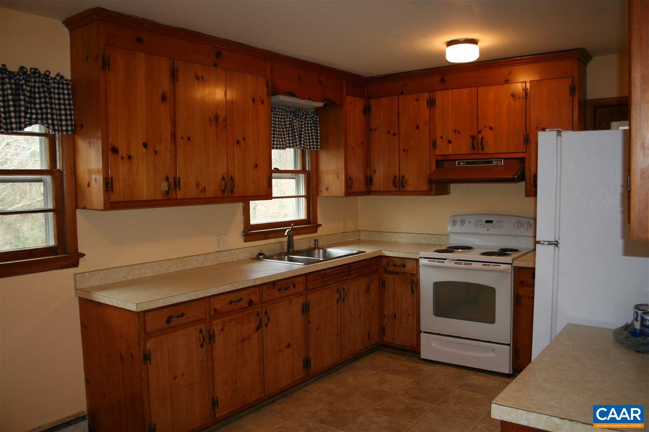 148 Good Hope Church Road Aroda, VA 22709 - Photo 3 of 10 a kitchen with a stove sink and cabinets