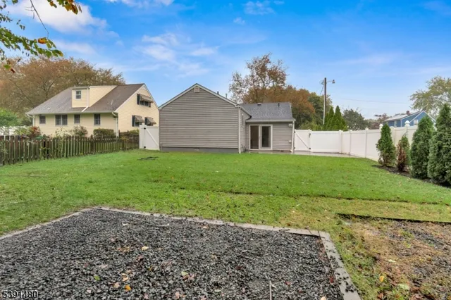 a front view of a house with yard