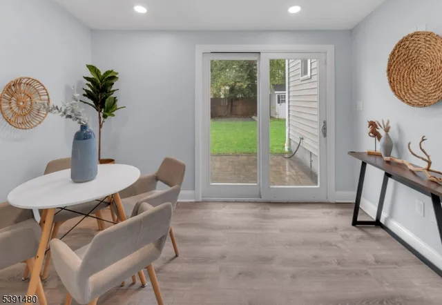 a view of a room with furniture and a window