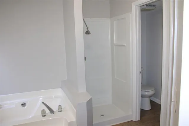 a bathroom with a bathtub and a window