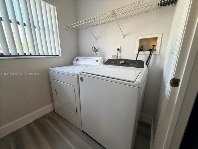 a view of a house with a yard and porch