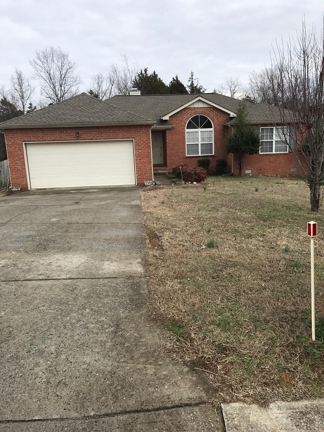 540 Windy Road Mount Juliet, TN 37122 - Photo 1 of 6 a front view of a house with a yard and garage