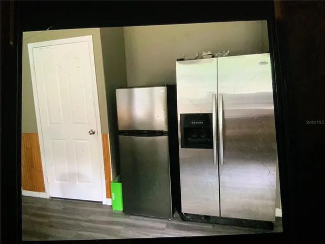 a bathroom with a glass shower door