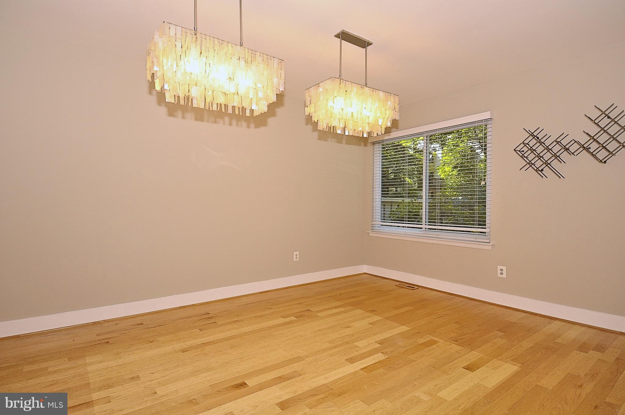 11744 Decade Court Reston, VA 20191 - Photo 17 of 30 Large dining room with designer light fixtures