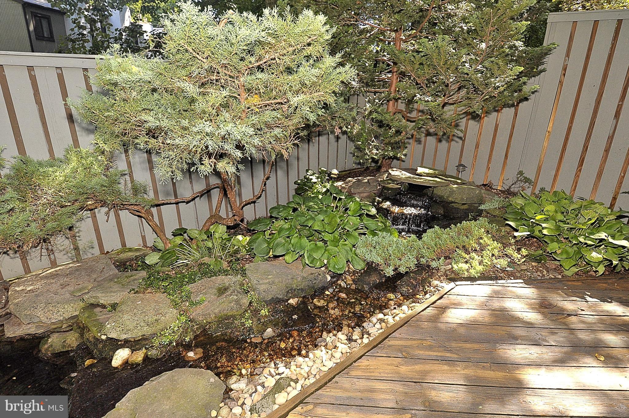 11744 Decade Court Reston, VA 20191 - Photo 22 of 30 Stone garden with tranquil waterfall