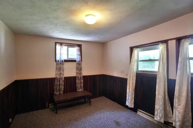 a bathroom with a bathtub a toilet and a shower