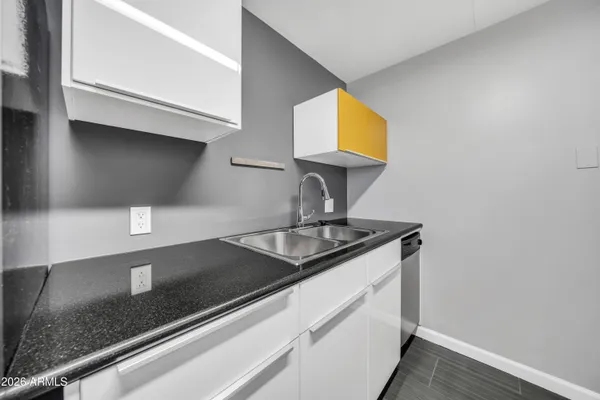 a kitchen with stainless steel appliances a sink a stove and refrigerator