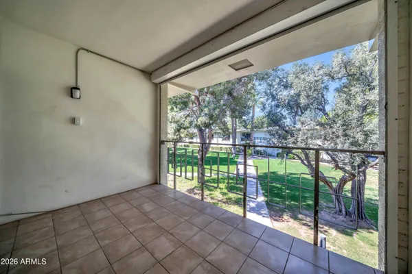 a view of a swimming pool with a yard