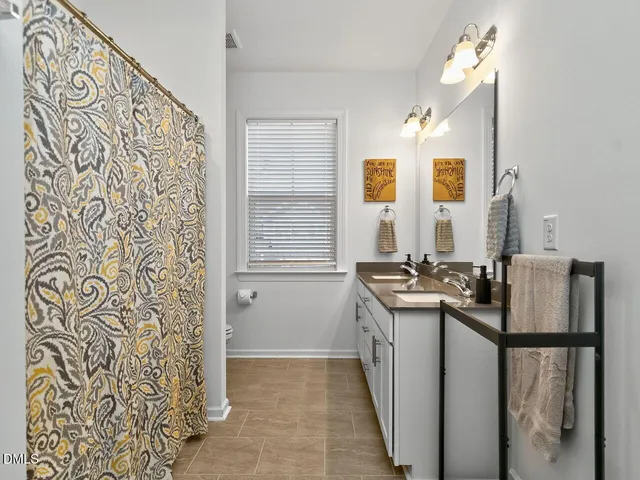 a bedroom with bed and a couch