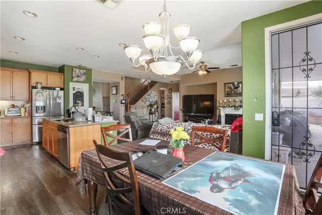a bathroom with a sink a toilet and a large mirror