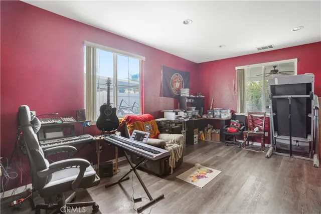 a view of a livingroom with furniture and a kitchen