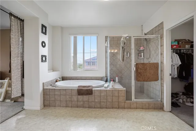 a bedroom with bed and a window