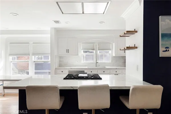 a dining room with table chairs and a window