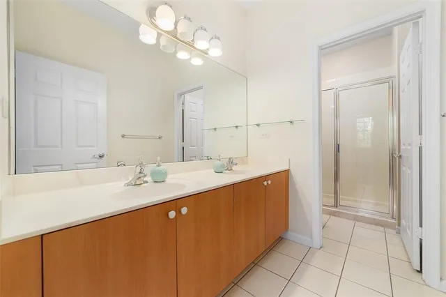 a bathroom with a sink a vanity and a mirror