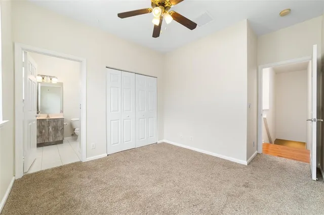 a view of an empty room and bathroom