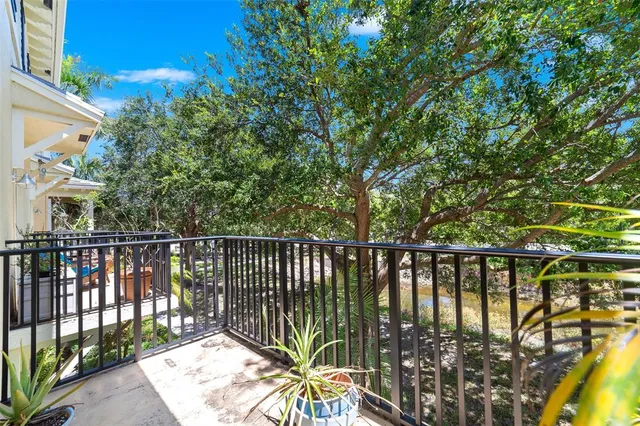 a balcony with wooden floor and outdoor space