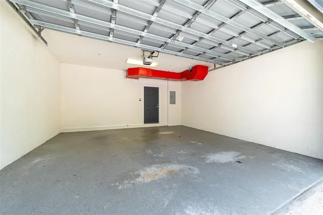 a couple of cars parked in front of a house