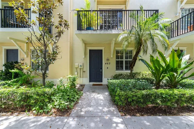 a view of a house with a flower garden