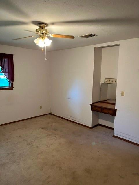 304 Sunset Street Roxton, TX 75477 - Photo 14 of 31 an empty room with windows and fan