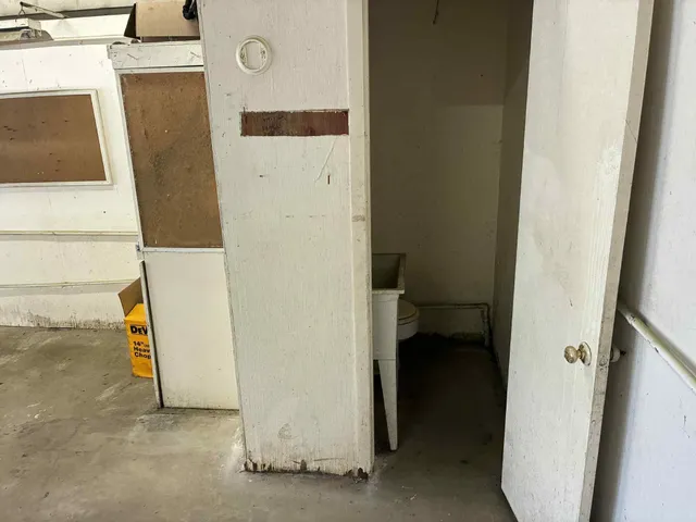 a utility room with a washing machine