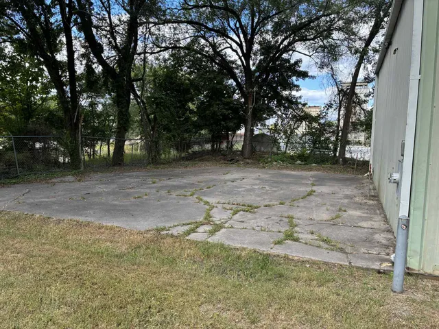 a view of a yard with trees