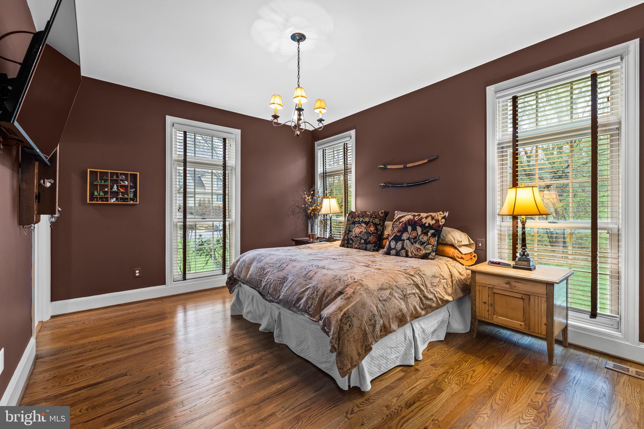 7 Hambleton Court Baltimore, MD 21208 - Photo 20 of 61 a bedroom with a bed chandelier and a window
