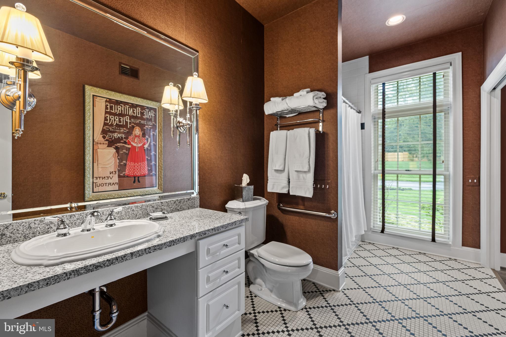 7 Hambleton Court Baltimore, MD 21208 - Photo 21 of 61 a bathroom with a granite countertop toilet sink and mirror