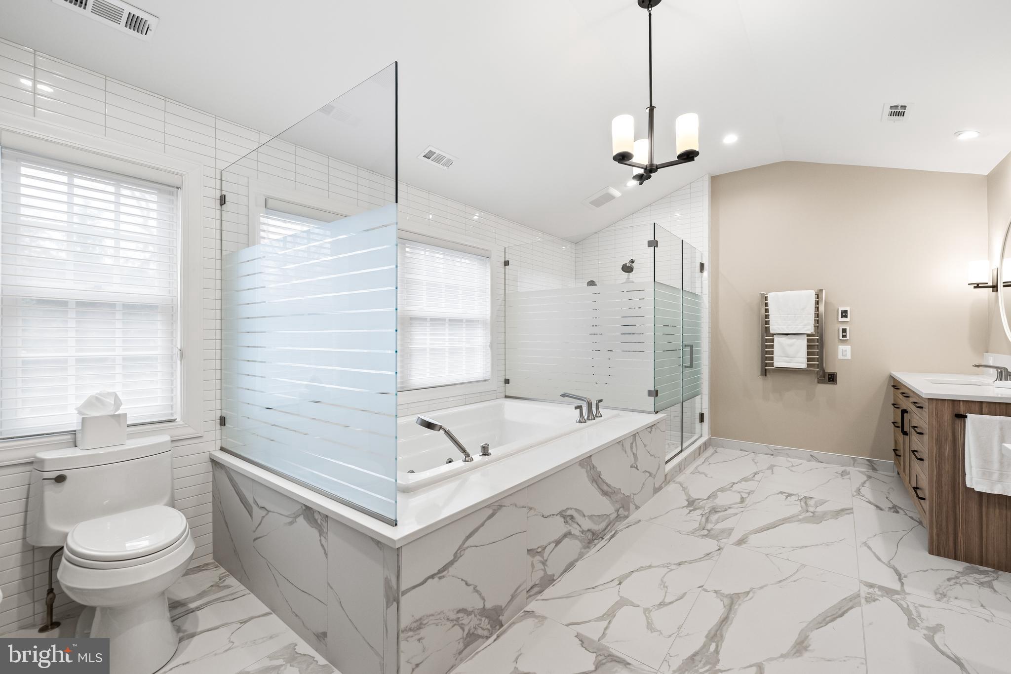 7 Hambleton Court Baltimore, MD 21208 - Photo 34 of 61 a spacious bathroom with a sink a toilet a mirror and shower