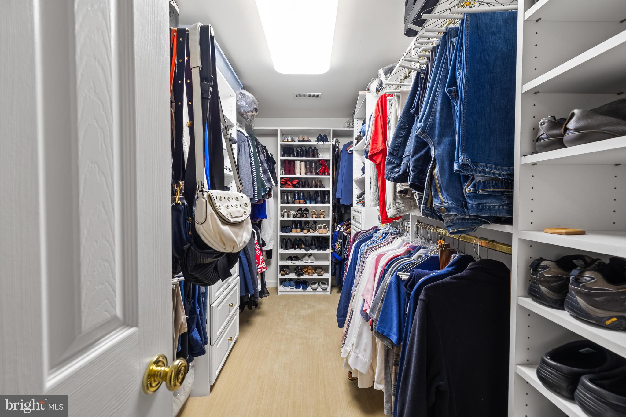 7 Hambleton Court Baltimore, MD 21208 - Photo 37 of 61 a view of walk in closet with clothes and shoes