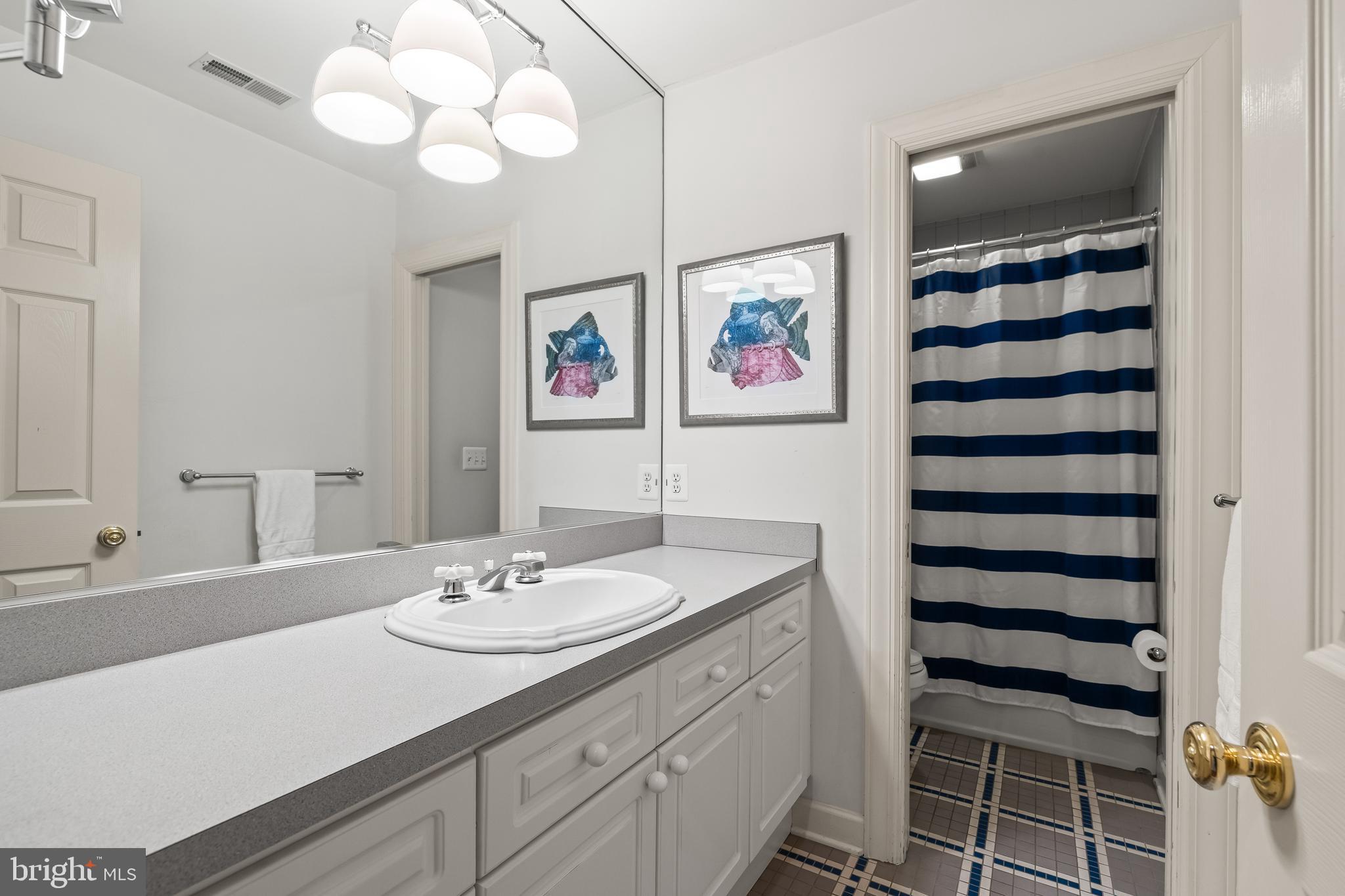 7 Hambleton Court Baltimore, MD 21208 - Photo 41 of 61 a bathroom with a sink a vanity and a large mirror