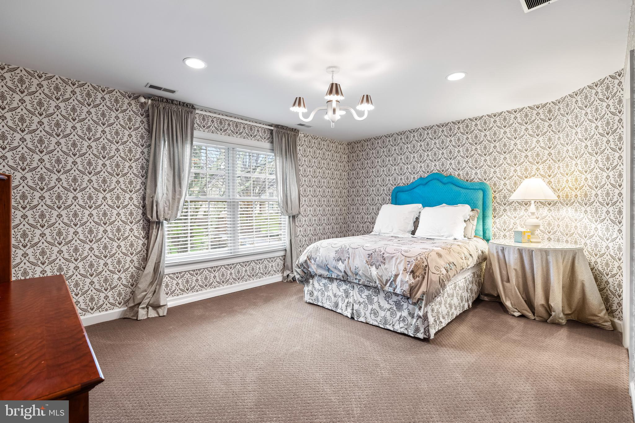 7 Hambleton Court Baltimore, MD 21208 - Photo 42 of 61 a spacious bedroom with a bed and a couch