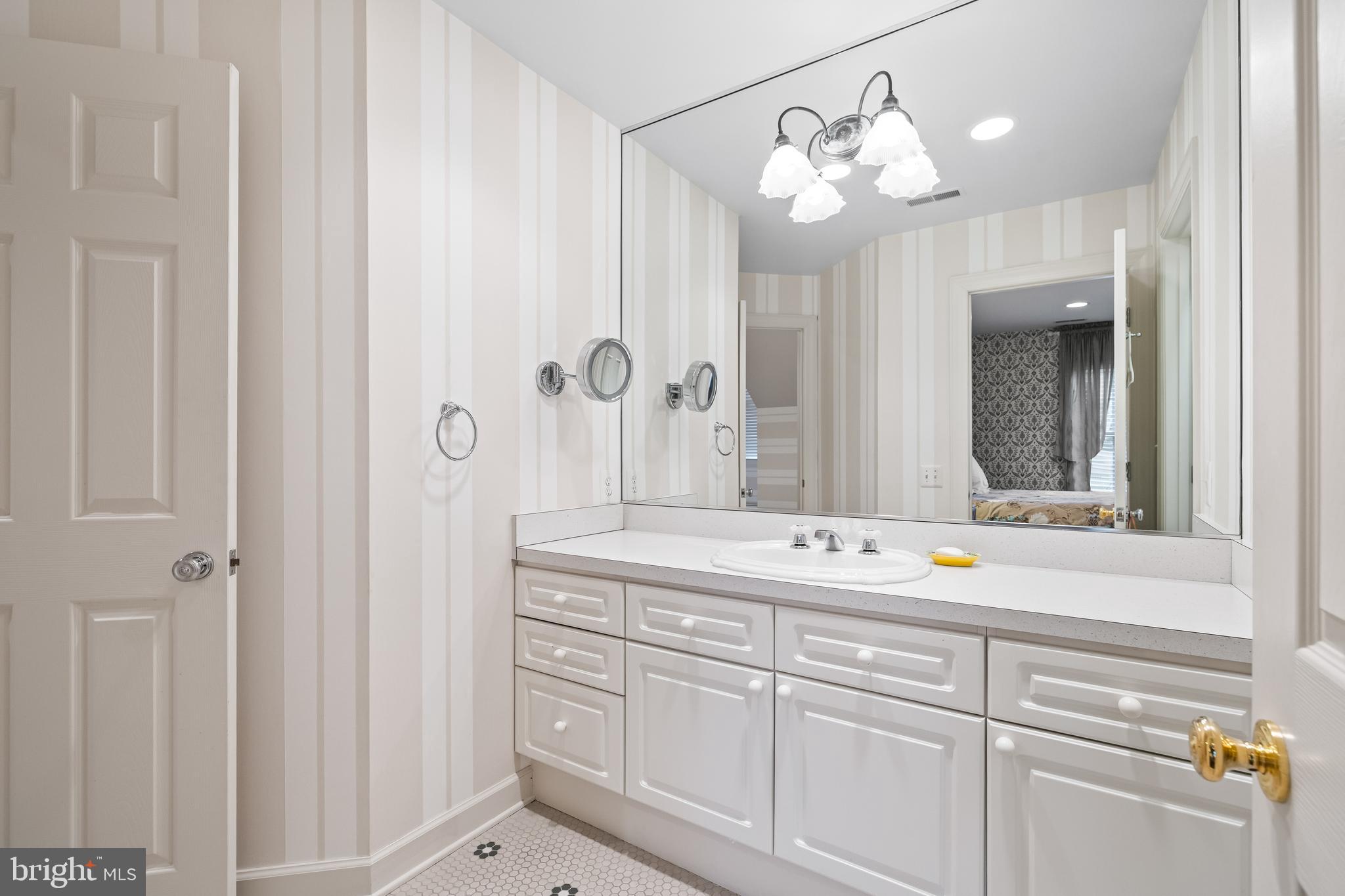 7 Hambleton Court Baltimore, MD 21208 - Photo 43 of 61 a bathroom with a sink and a mirror