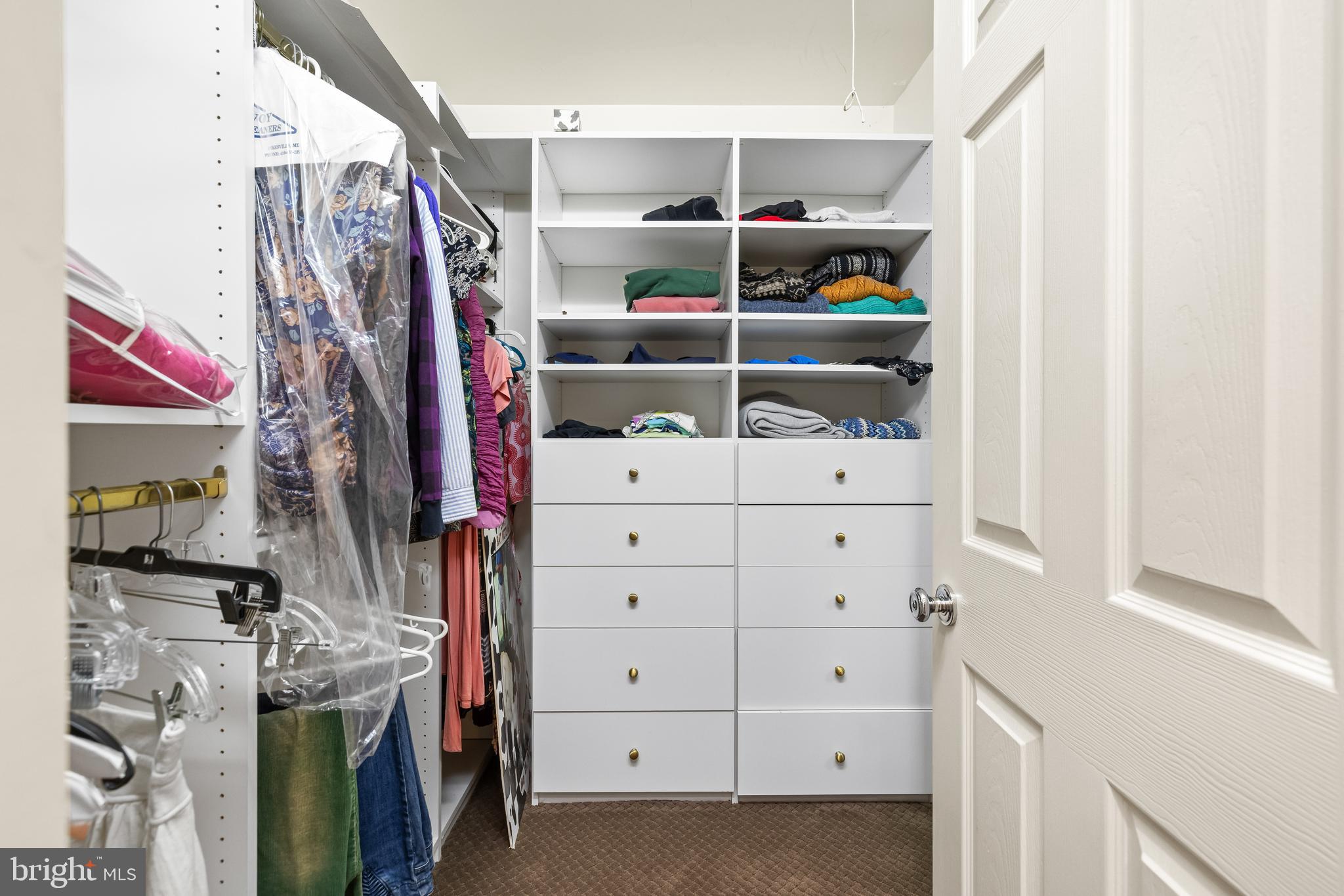 7 Hambleton Court Baltimore, MD 21208 - Photo 44 of 61 a view of walk in closet with clothes and shoes