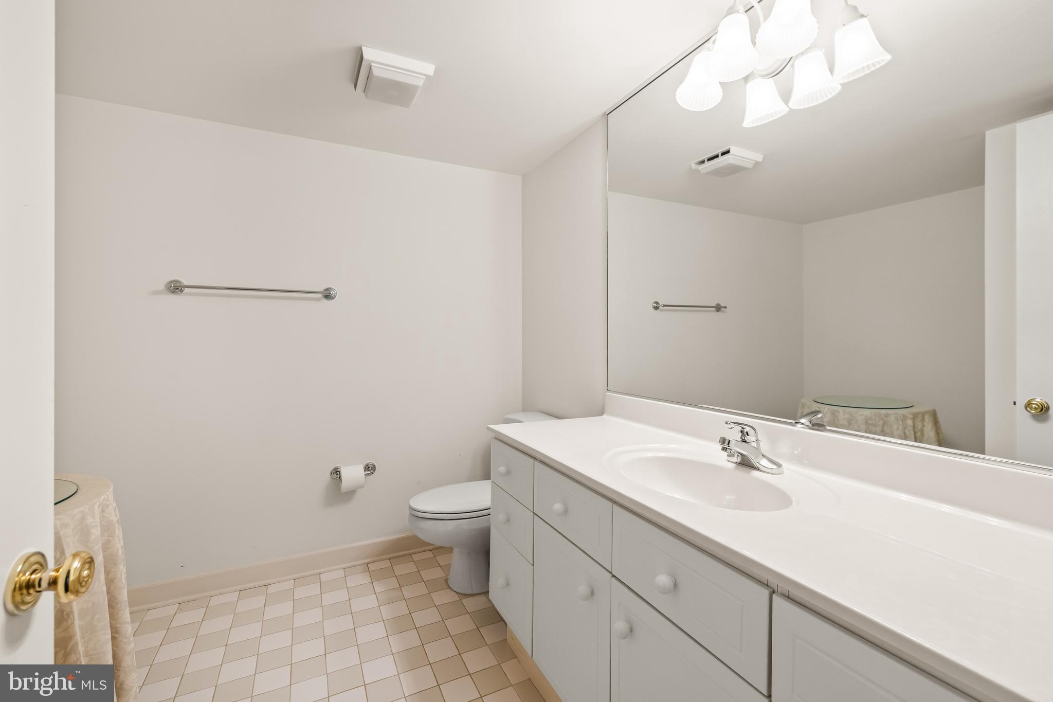 7 Hambleton Court Baltimore, MD 21208 - Photo 50 of 61 a bathroom with a sink a toilet and mirror