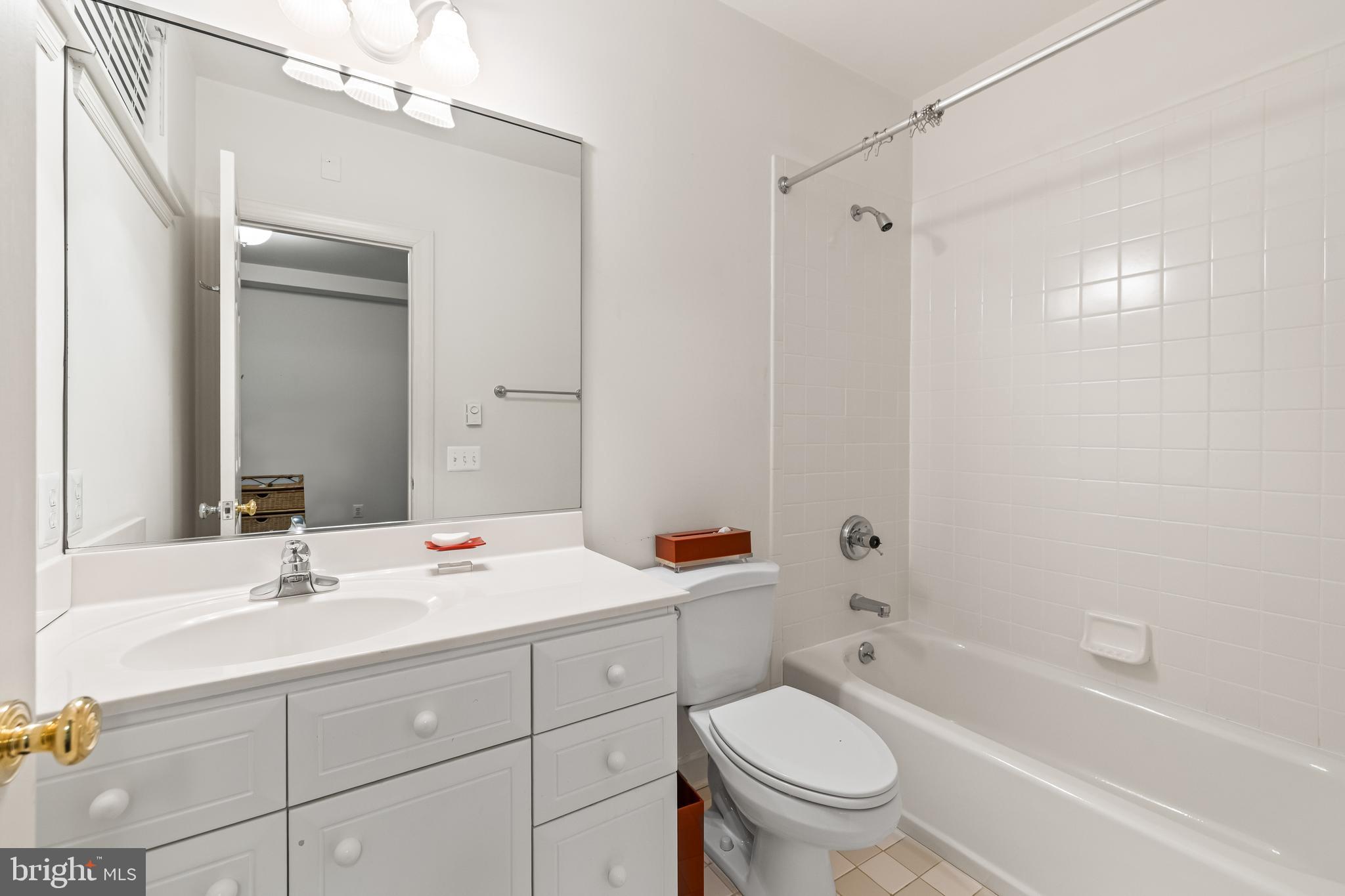 7 Hambleton Court Baltimore, MD 21208 - Photo 52 of 61 a bathroom with a sink a toilet and shower