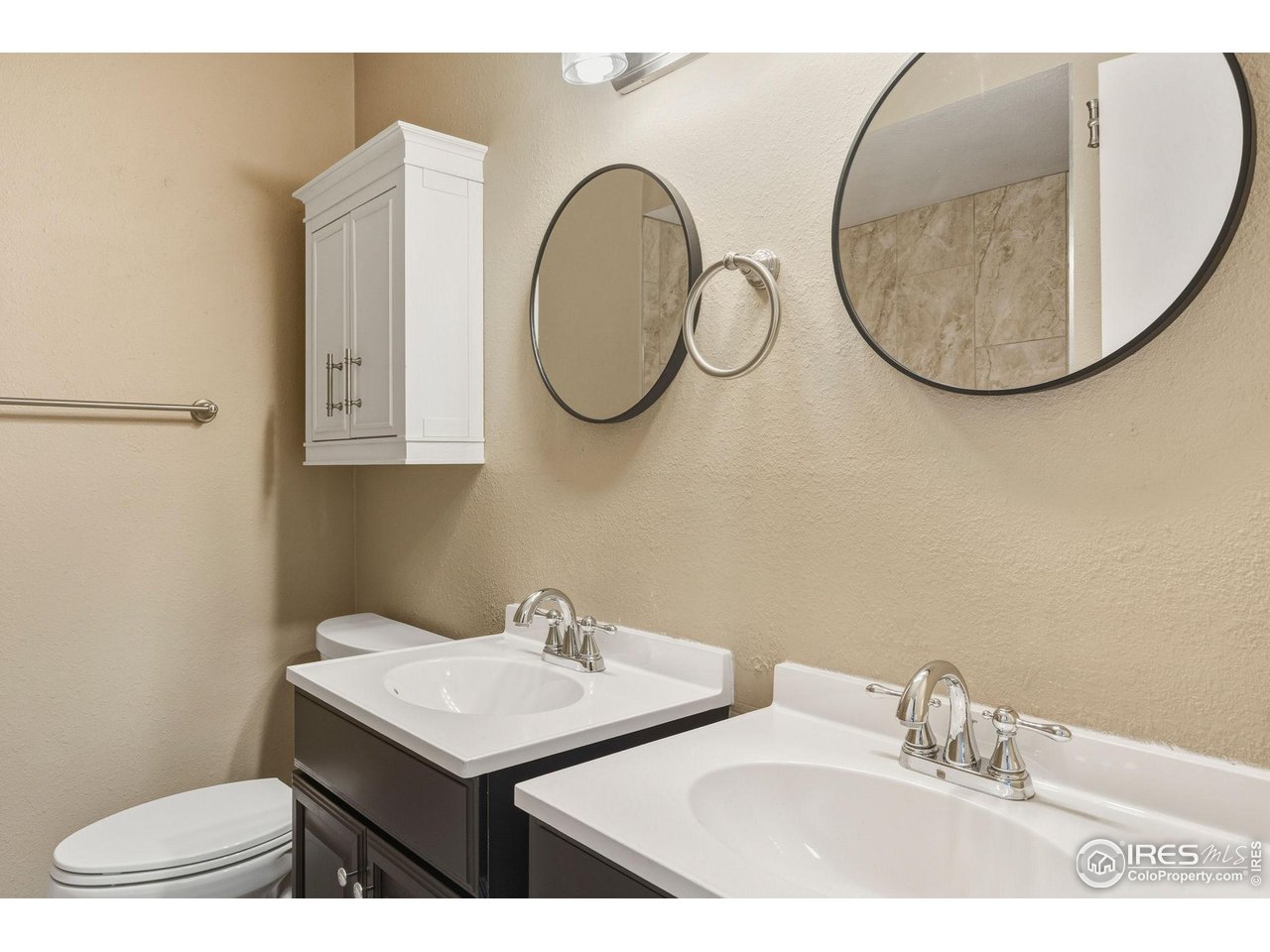 1705 Heatheridge Road, Unit 103 Fort Collins, CO 80526 - Photo 14 of 16 a bathroom with a sink and a mirror