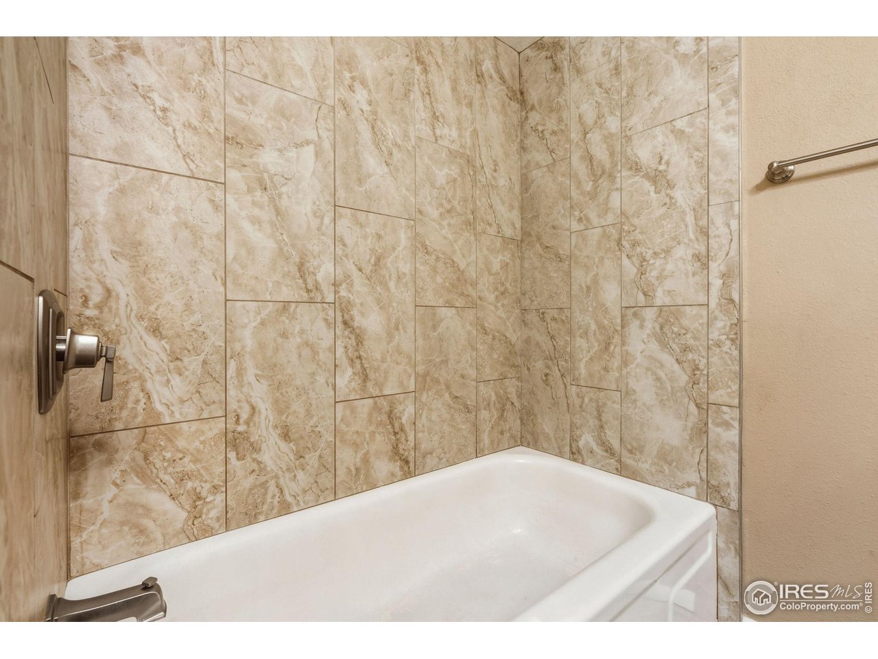 1705 Heatheridge Road, Unit 103 Fort Collins, CO 80526 - Photo 15 of 16 a bathroom with a shower