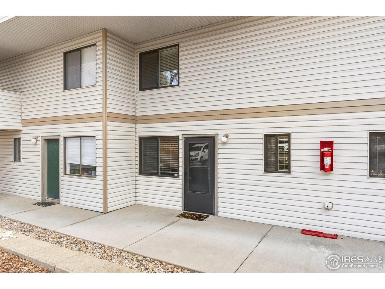 1705 Heatheridge Road, Unit 103 Fort Collins, CO 80526 - Photo 2 of 16 a view of a white house