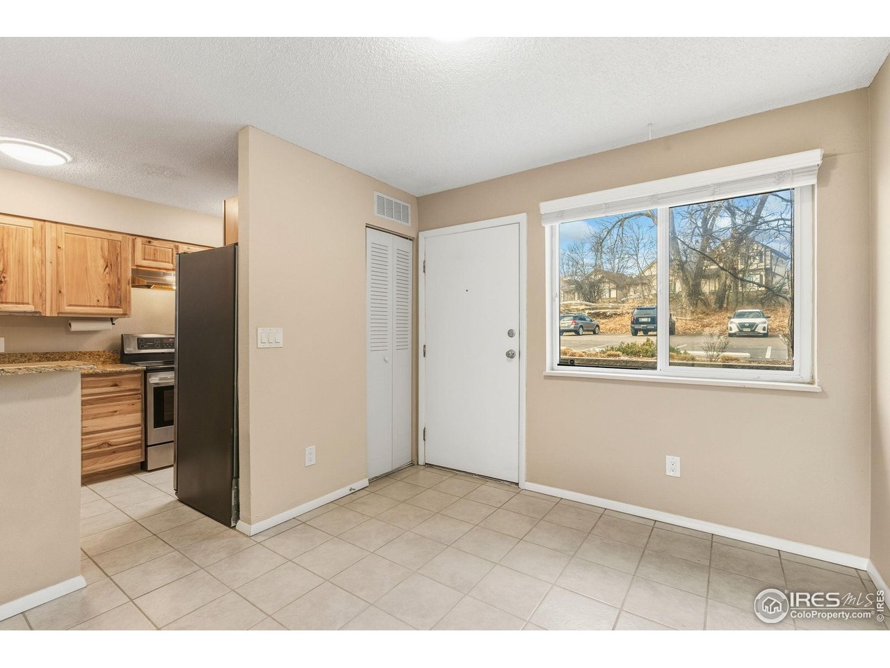 1705 Heatheridge Road, Unit 103 Fort Collins, CO 80526 - Photo 6 of 16 a view interior of kitchen and kitchen with wooden floor