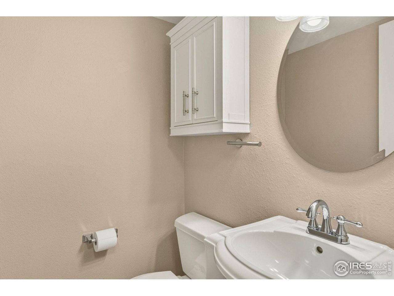 1705 Heatheridge Road, Unit 103 Fort Collins, CO 80526 - Photo 10 of 16 a bathroom with a sink mirror and vanity