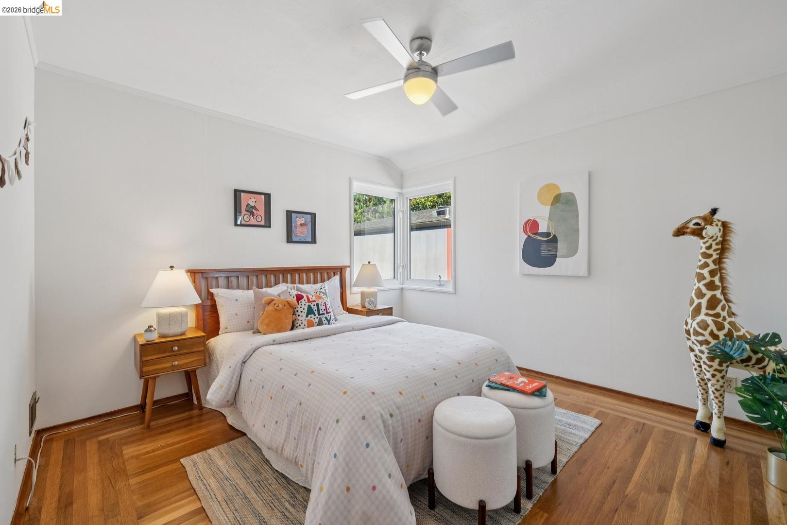 155 Avenida Drive Berkeley, CA 94708 - Photo 34 of 86 Hardwood flooring, white walls, and a ceiling fan with integrated lighting