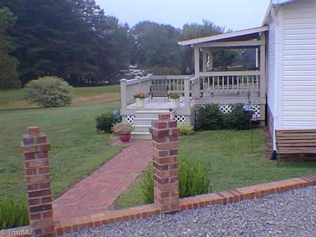 434 Quaker Church Road Siloam, NC 27047 - Photo 3 of 5 Other. Side Front, Cov Porch, Brick Walk