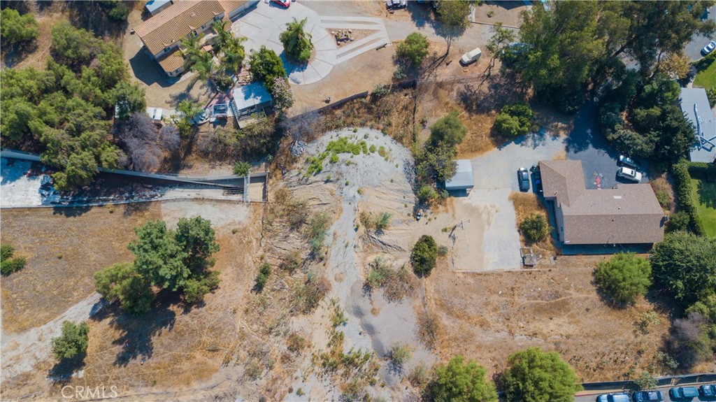 13570 Turnbull Canyon Road Whittier, CA 90601 - Photo 8 of 15 an aerial view of a house with a yard and a large tree