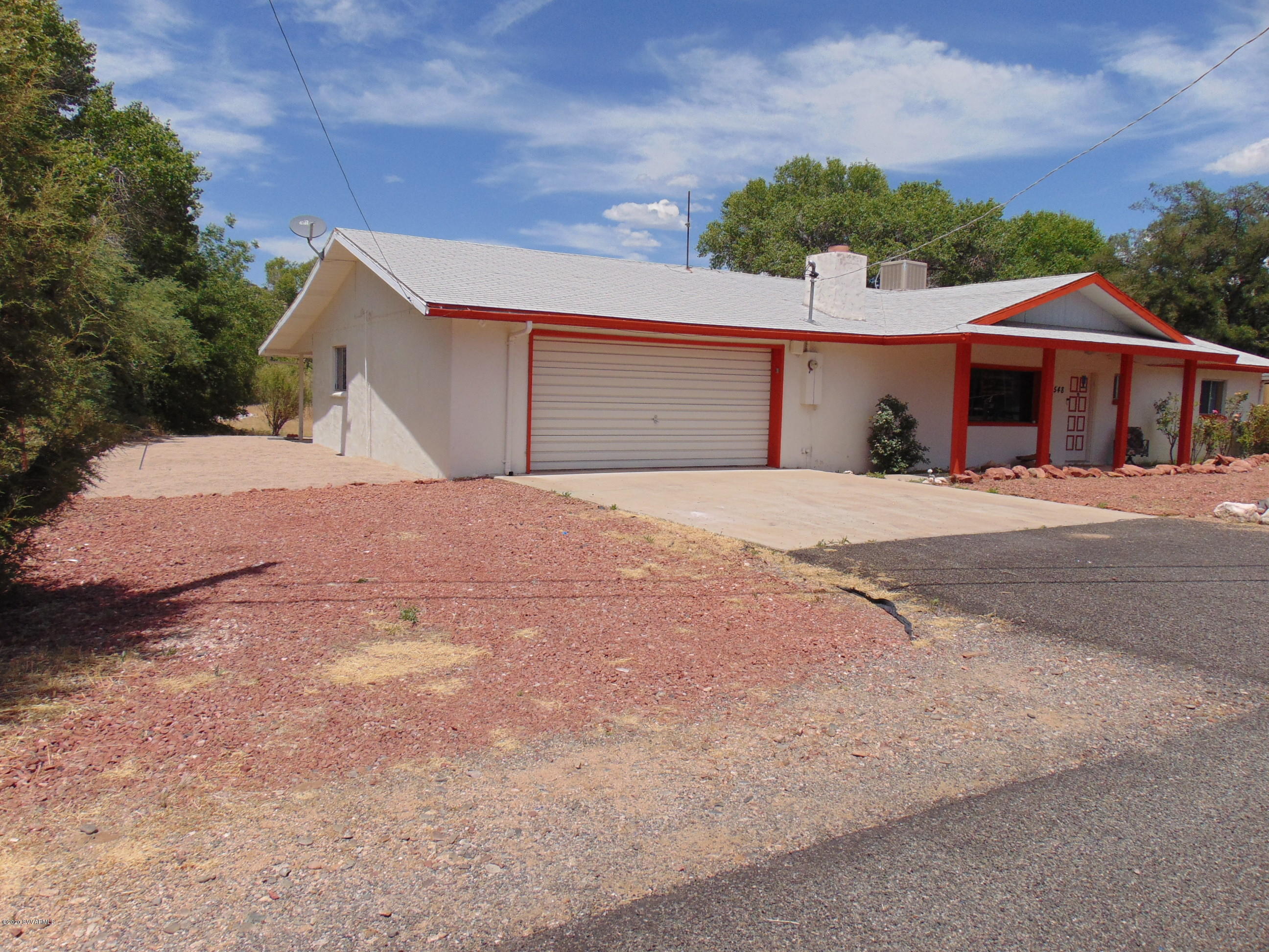 3548 East Rimrock Drive Rimrock, AZ 86335 - Photo 2 of 30 a front view of a house with a yard and garage